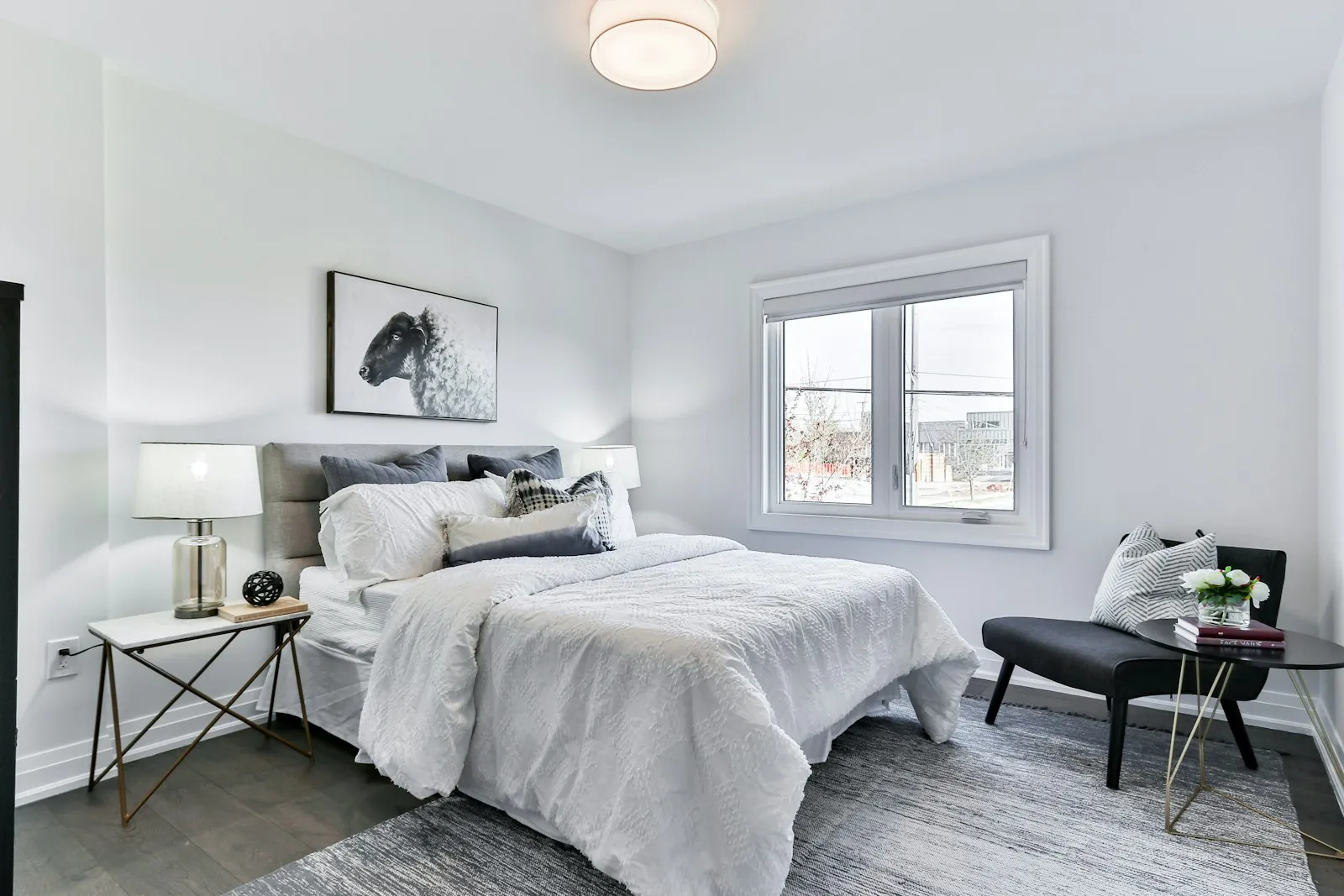A bright bedroom with crisp white bedding after a standard cleaning